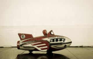 Antique rocket racer toy