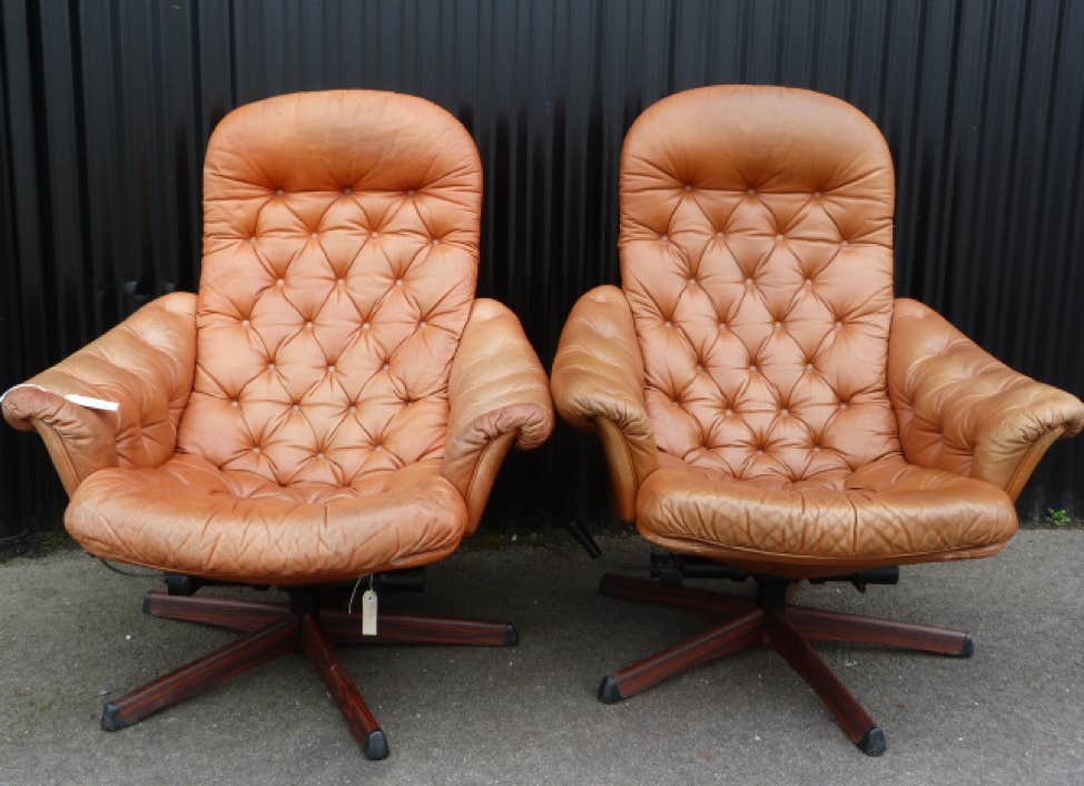 Swivel pale brown leather chairs